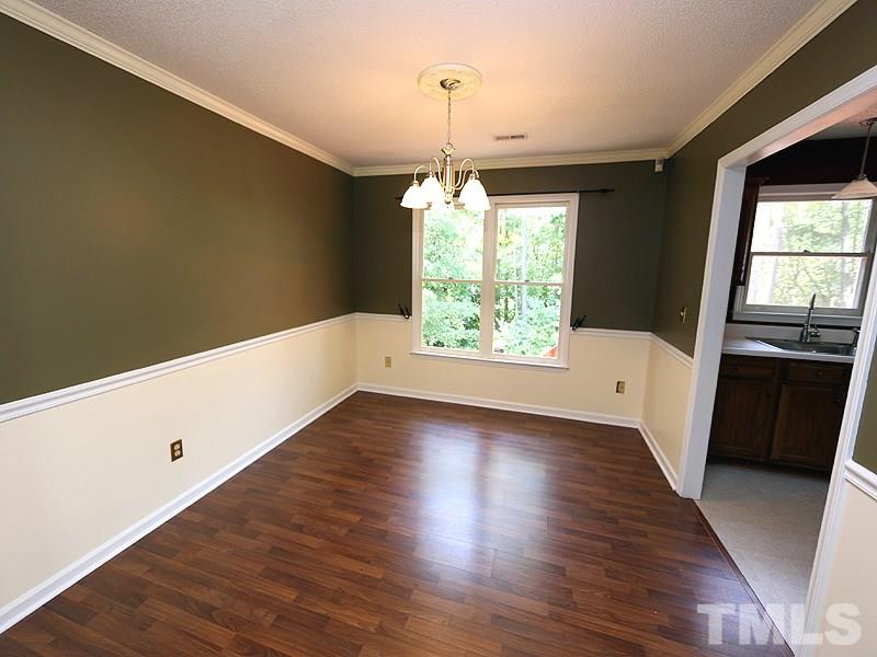 3505 Singleleaf Lane Raleigh, NC 27616 - Photo 4 of 14 an empty room with wooden floor and windows