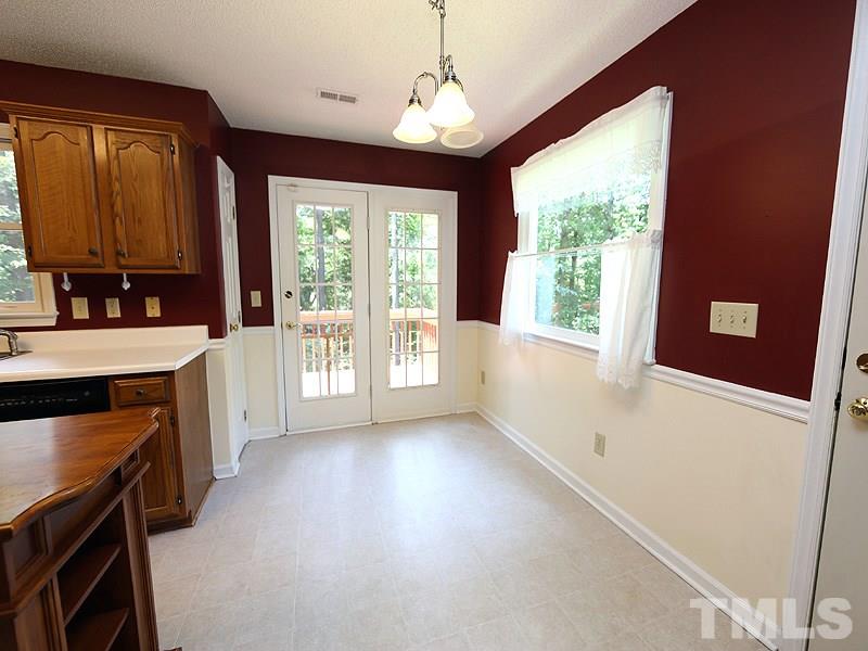 3505 Singleleaf Lane Raleigh, NC 27616 - Photo 5 of 14 a view of a kitchen with a stove cabinets and a large window