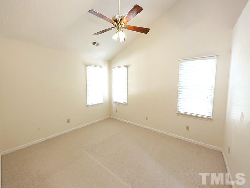 3505 Singleleaf Lane Raleigh, NC 27616 - Photo 6 of 14 an empty room with a window and a fan
