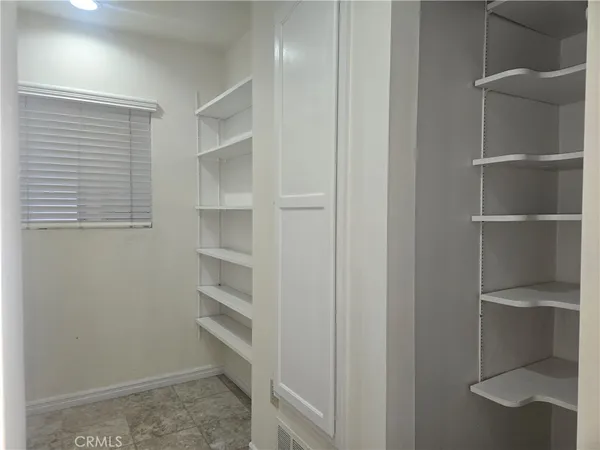 a view of an empty walk in closet