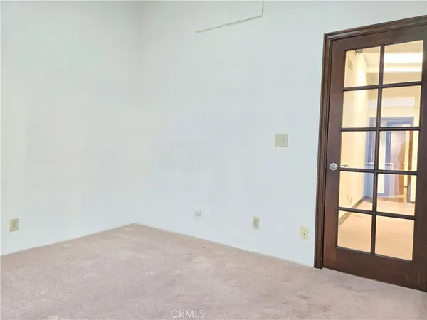 a view of empty room with windows