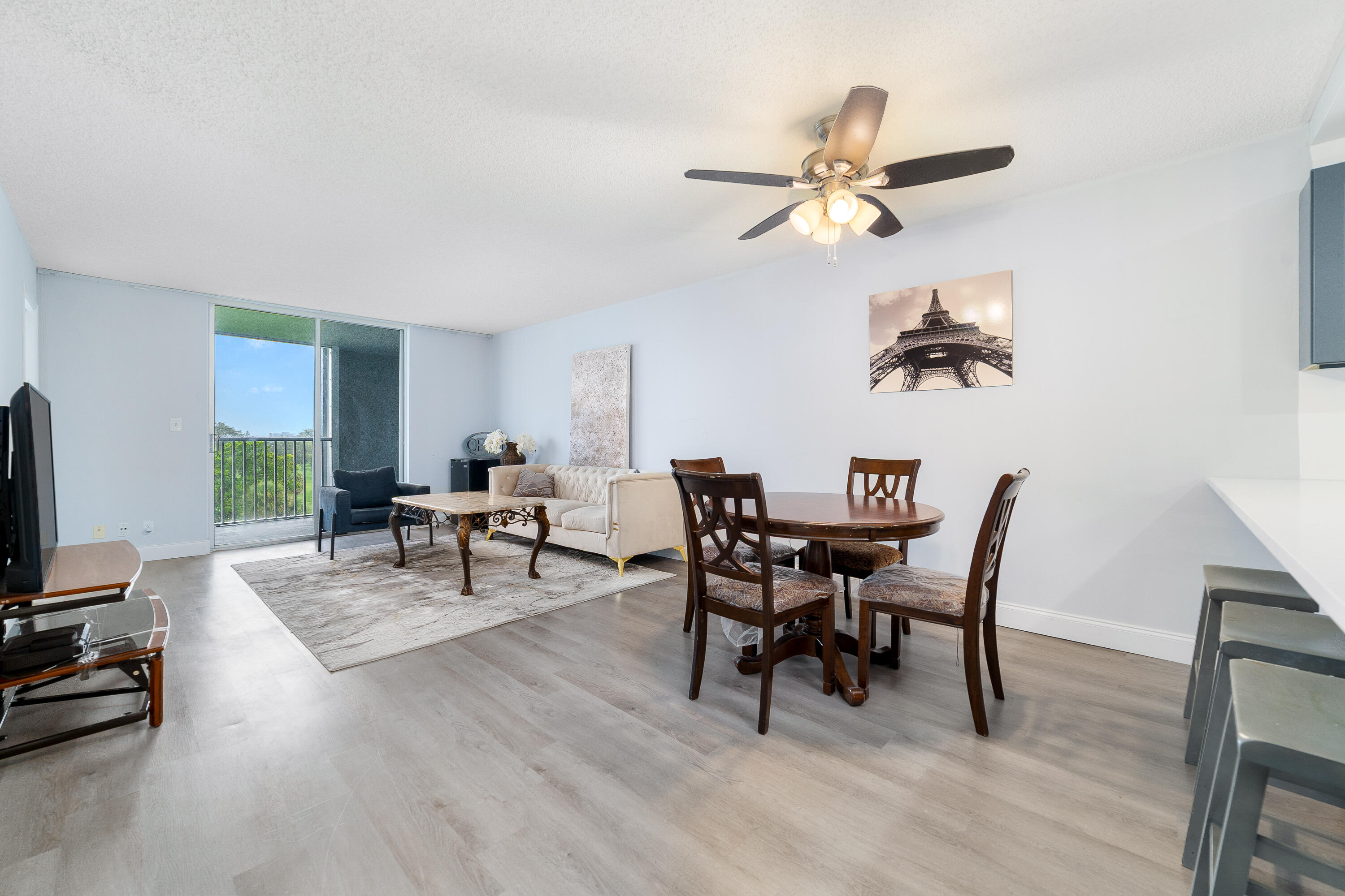 5301 Northwest 2nd Avenue, Unit PHE Boca Raton, FL 33487 - Photo 3 of 24 a view of a dining room with furniture and a window
