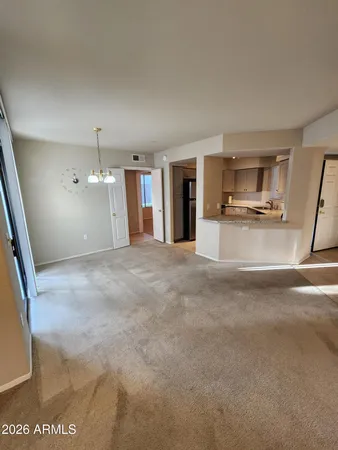 a view of an empty room with a fireplace