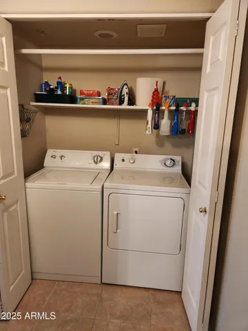 a bathroom with a sink a toilet a mirror and shower curtain