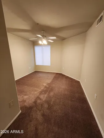 a view of empty room with a fireplace