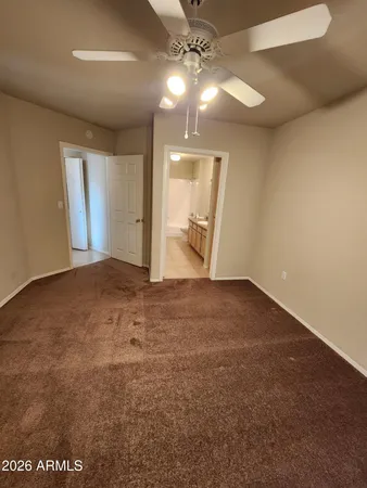 an empty room with windows and entrance