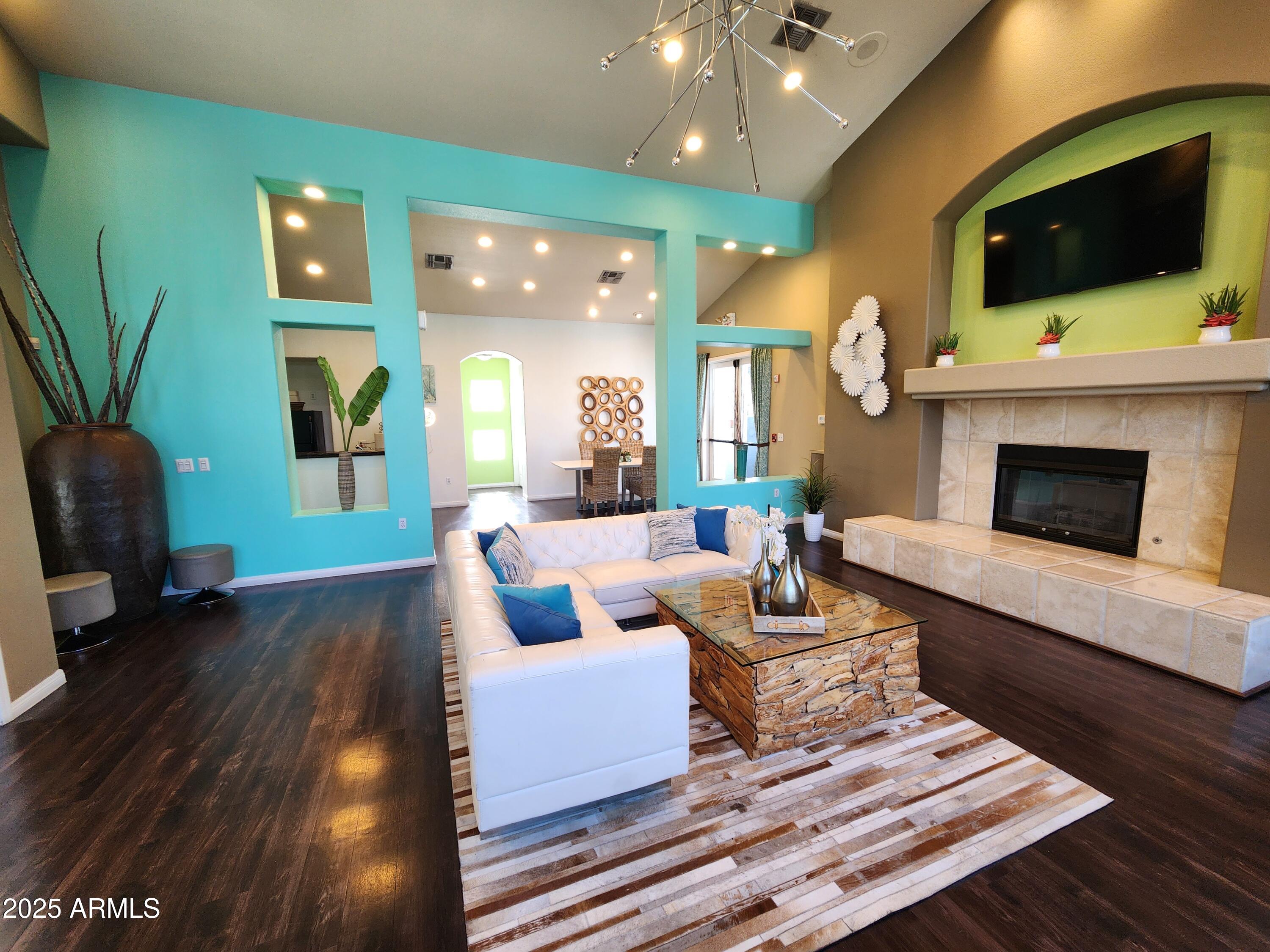 3848 North 3rd Avenue, Unit 1044 Phoenix, AZ 85013 - Photo 19 of 22 a living room with fireplace furniture and a flat screen tv