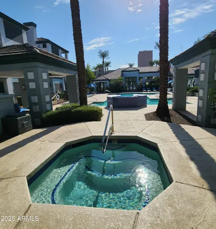 a swimming pool with outdoor seating yard and barbeque oven