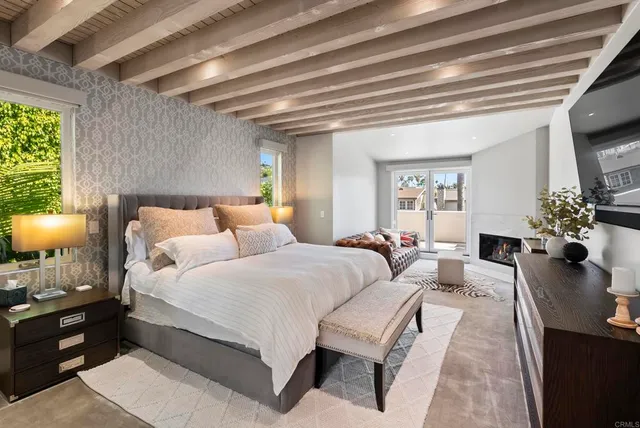 a bedroom with bed and a couch