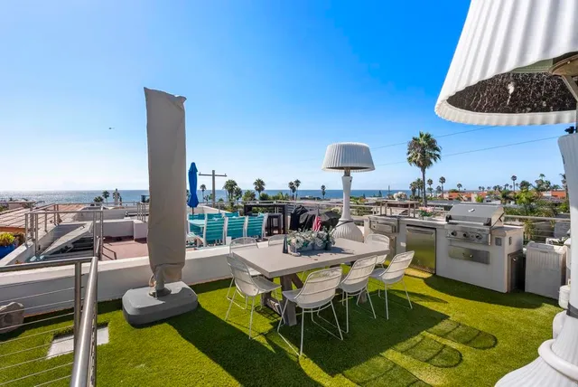 a dining room with furniture and a floor to ceiling window