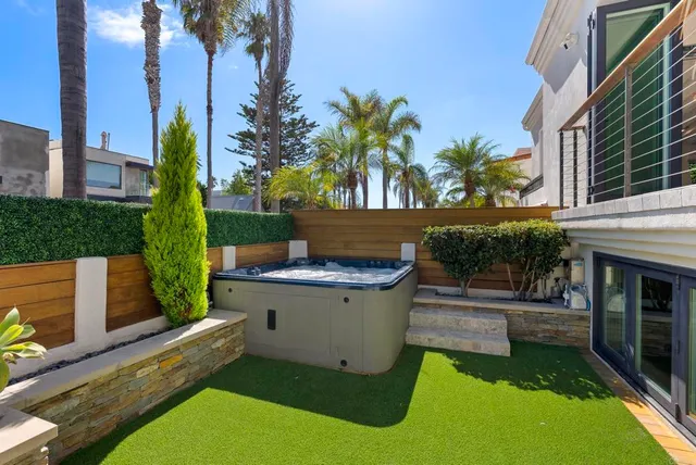 a view of a small yard in front of a house