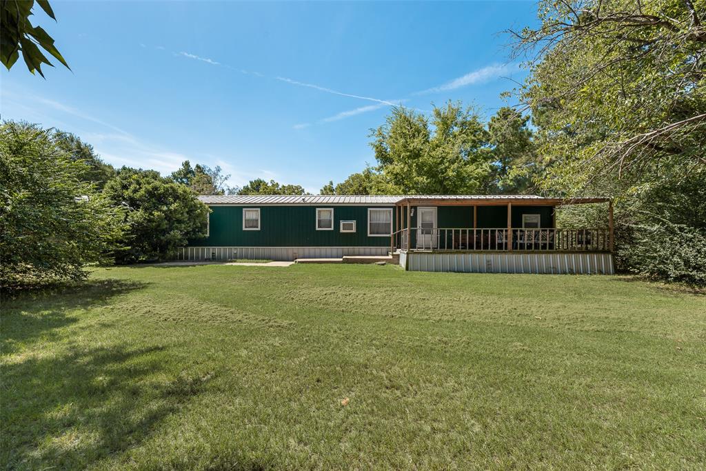 front view of a house with a big yard