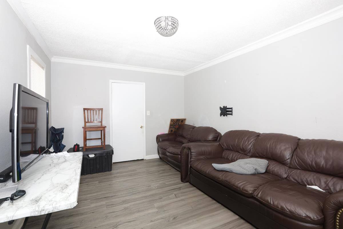 1023 Parkland Road Memphis, TN 38111 - Photo 4 of 13 a living room with furniture window and a flat screen tv