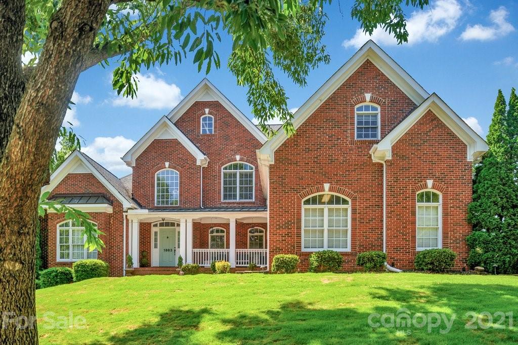 1883 Chestnut Hill Drive Tega Cay, SC 29708 - Photo 1 of 34 a front view of a house with a yard