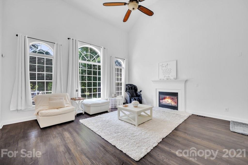 1883 Chestnut Hill Drive Tega Cay, SC 29708 - Photo 14 of 34 a living room with furniture and a fireplace