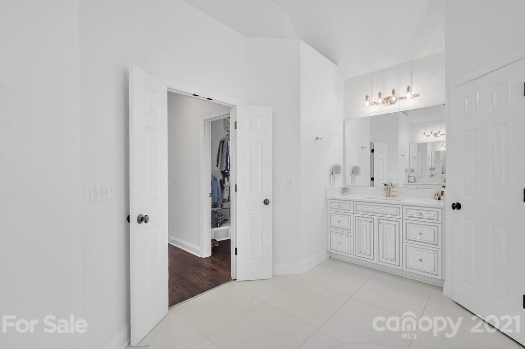 1883 Chestnut Hill Drive Tega Cay, SC 29708 - Photo 17 of 34 a bathroom with a sink a toilet and shower