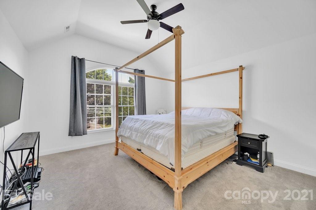 1883 Chestnut Hill Drive Tega Cay, SC 29708 - Photo 18 of 34 a bed room with a bed and a chair