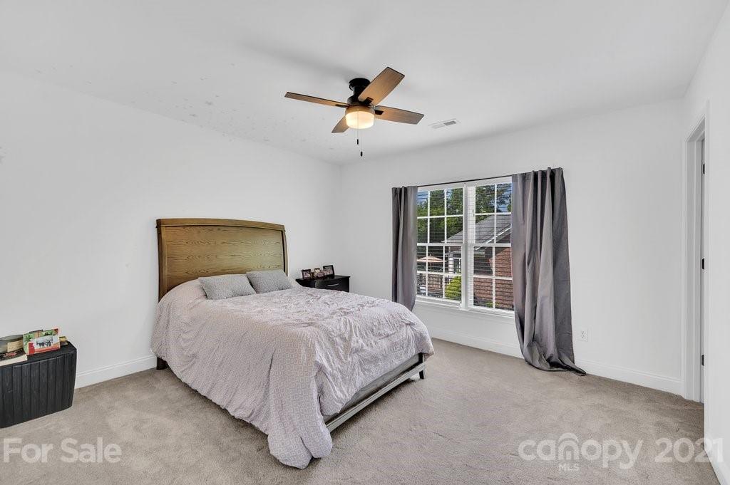 1883 Chestnut Hill Drive Tega Cay, SC 29708 - Photo 19 of 34 a bedroom with a bed and a window