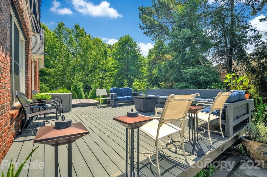 1883 Chestnut Hill Drive Tega Cay, SC 29708 - Photo 25 of 34 a view of a patio with table and chairs and couches