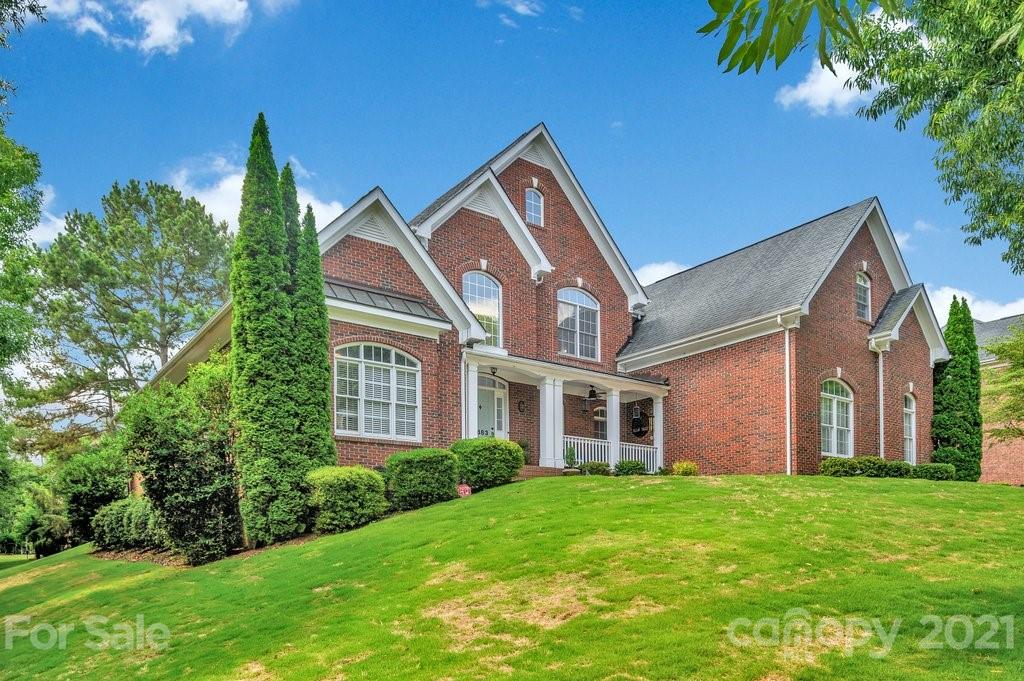 1883 Chestnut Hill Drive Tega Cay, SC 29708 - Photo 27 of 34 a front view of house with yard and green space
