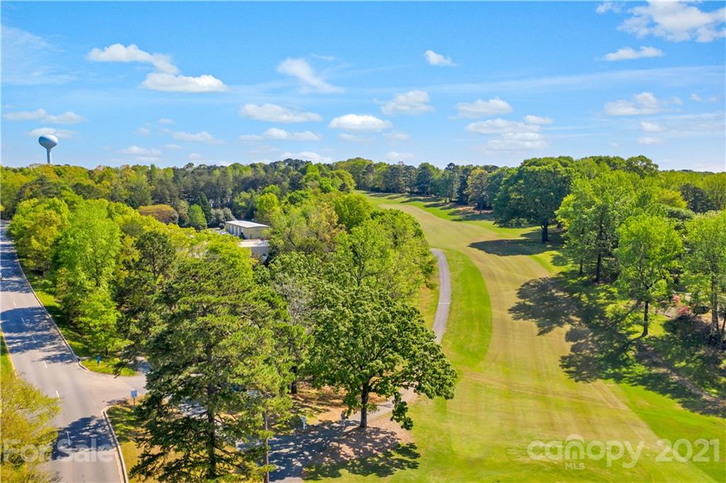 1883 Chestnut Hill Drive Tega Cay, SC 29708 - Photo 33 of 34 a view of a lake with a garden