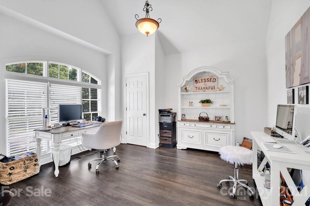 1883 Chestnut Hill Drive Tega Cay, SC 29708 - Photo 5 of 34 a view of a workspace with furniture and a window