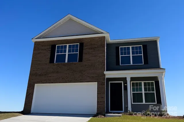 a front view of a house with large windows