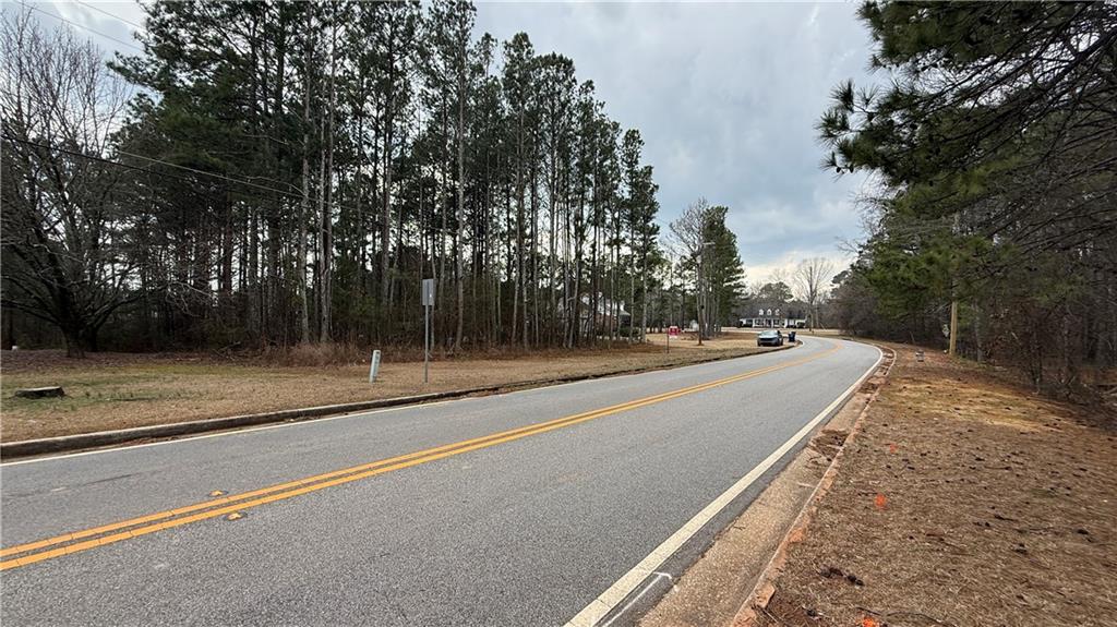 9127 East Carroll Road Winston, GA 30187 - Photo 5 of 5 a view of a road with a trees on the side of the road