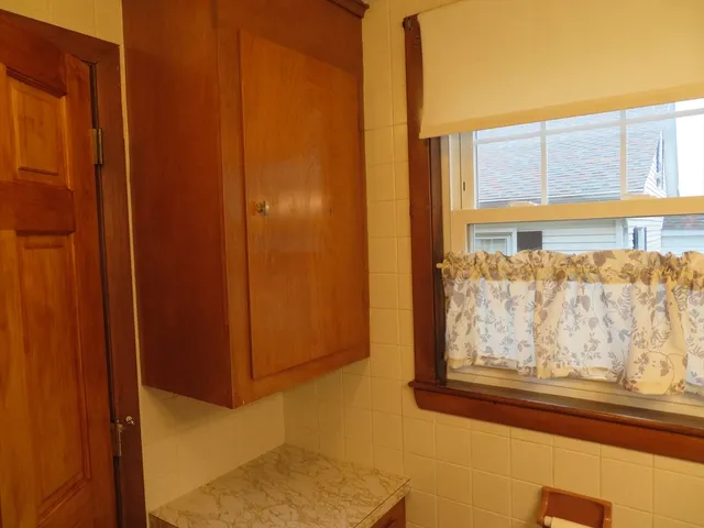 a view of a door and a window