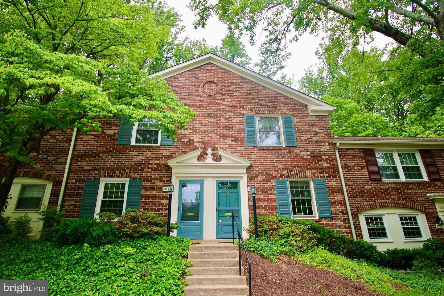 5918 Prince George Drive, Unit 313 Springfield, VA 22152 - Photo 1 of 29 front view of a house with a yard