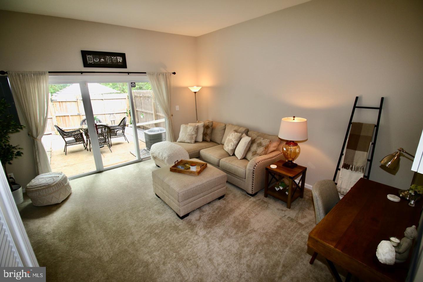 5918 Prince George Drive, Unit 313 Springfield, VA 22152 - Photo 16 of 29 a living room with furniture and a large window