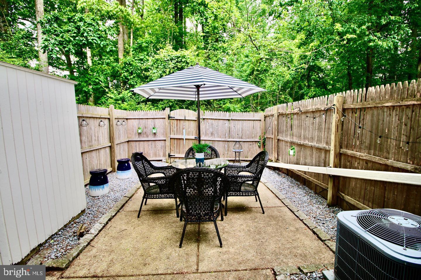 5918 Prince George Drive, Unit 313 Springfield, VA 22152 - Photo 18 of 29 a patio with a table and chairs