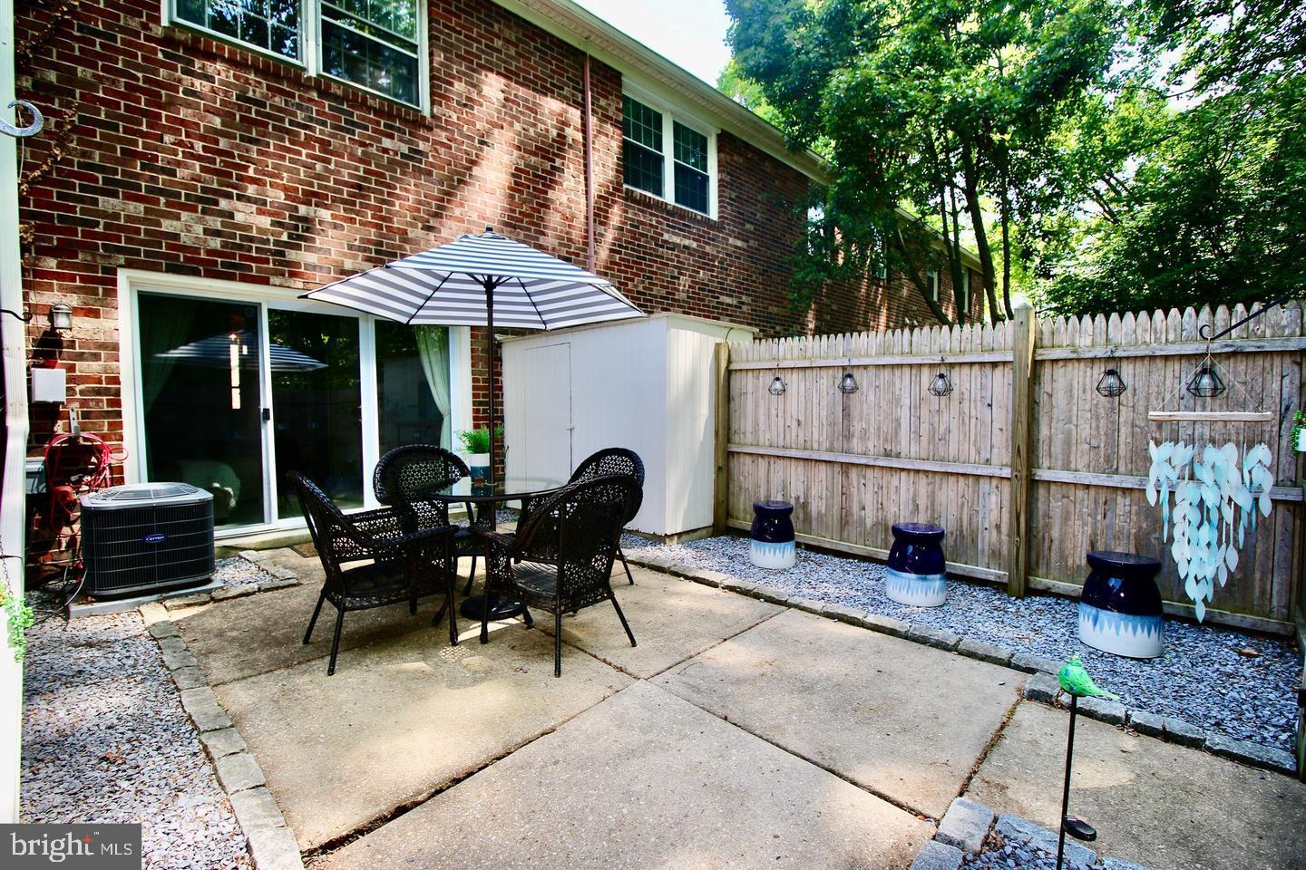 5918 Prince George Drive, Unit 313 Springfield, VA 22152 - Photo 19 of 29 a view of a house with backyard and sitting area