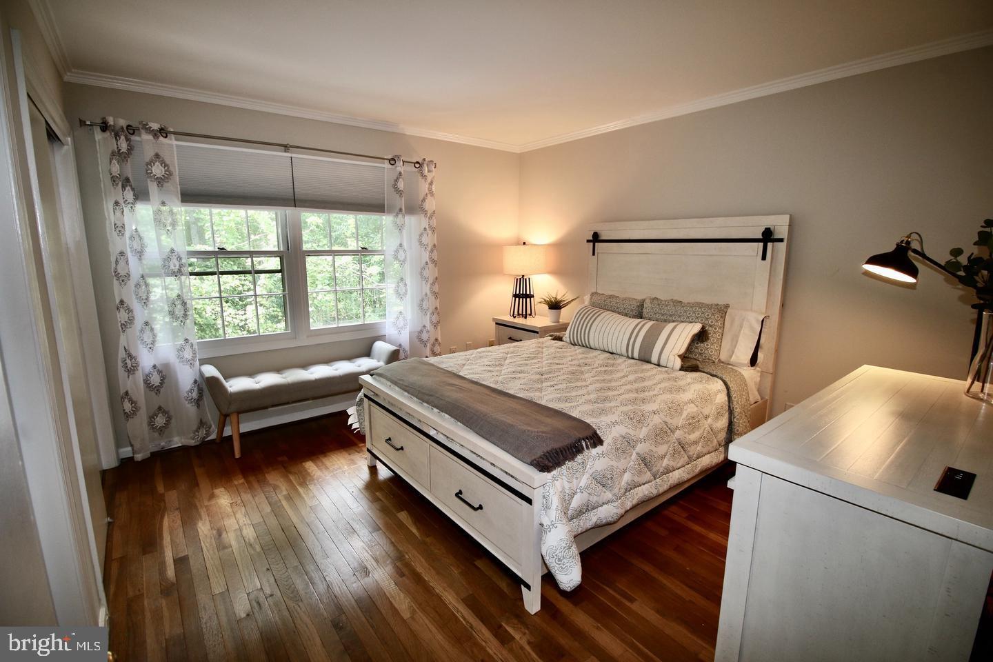 5918 Prince George Drive, Unit 313 Springfield, VA 22152 - Photo 24 of 29 a bedroom with a bed and a window