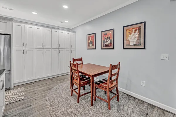 a kitchen with stainless steel appliances kitchen island granite countertop a refrigerator and a stove top oven