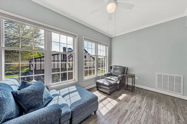 a view of a livingroom with workspace and a couch
