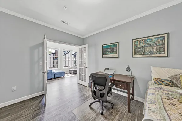 a workspace with furniture and wooden floor
