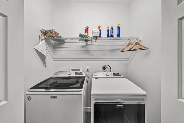 a bedroom with a bed and flat screen tv