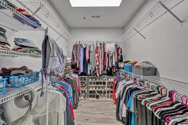 a bedroom with a bed and a television