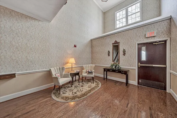 a view of room with furniture and book shelf