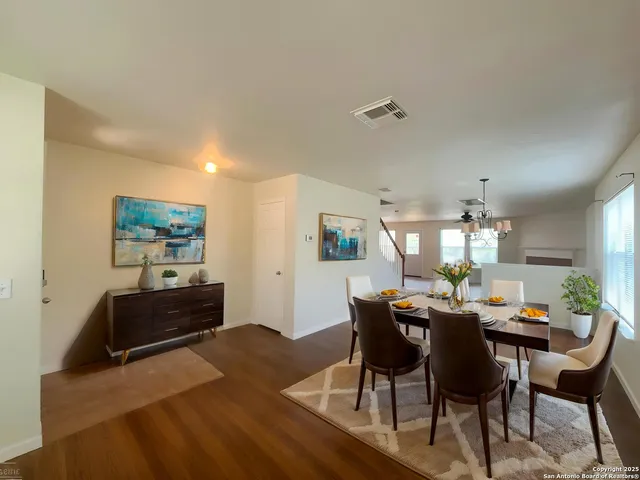 a dining room with furniture and window