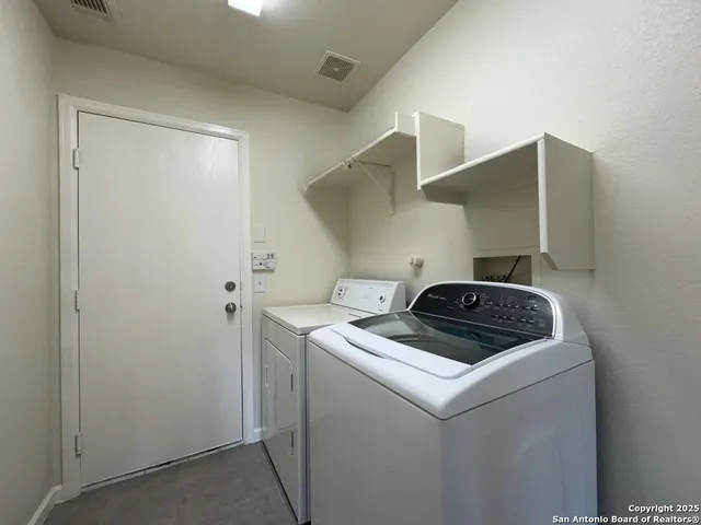 an empty room with wooden floor and a window