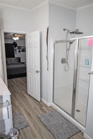 a bathroom with a shower and a mirror