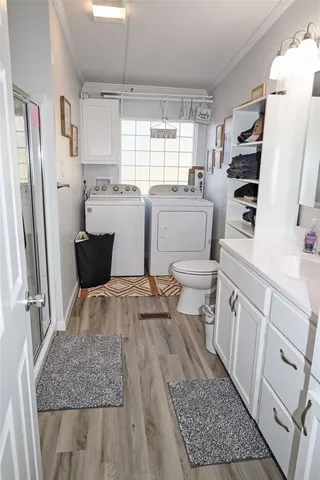 a room with a sink stove and refrigerator