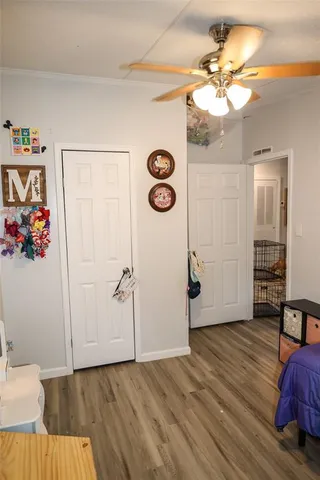 a view of an entryway with wooden floor