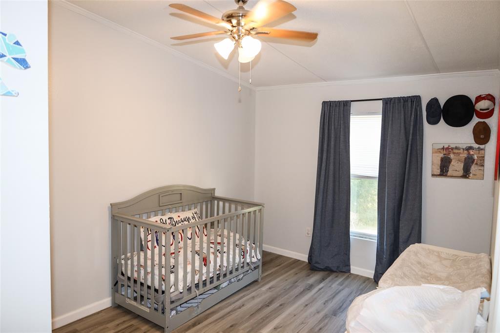 214 Destiny Lane Keatchie, LA 71046 - Photo 28 of 40 a view of a bedroom with wooden floor
