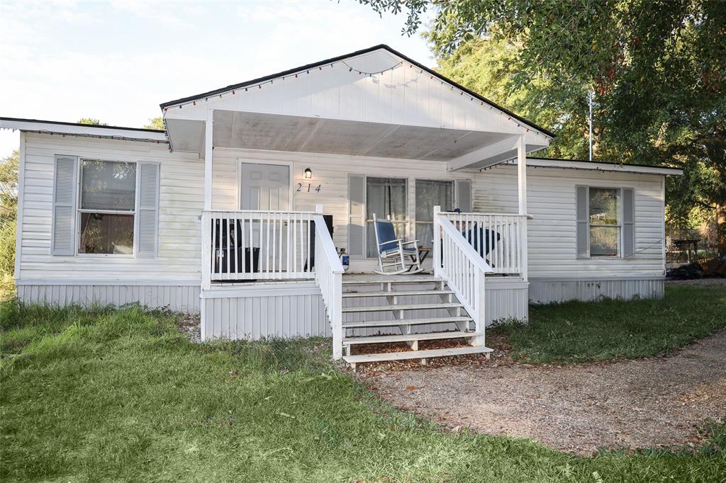 214 Destiny Lane Keatchie, LA 71046 - Photo 3 of 40 a front view of a house with a yard