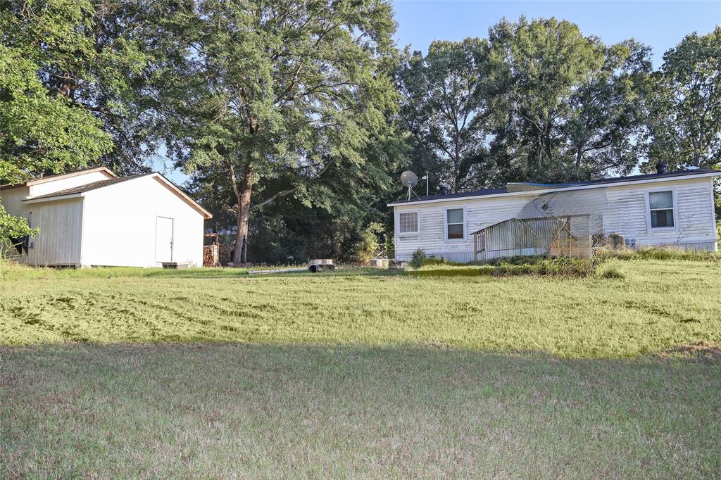 214 Destiny Lane Keatchie, LA 71046 - Photo 32 of 40 a house with swimming pool in front of it