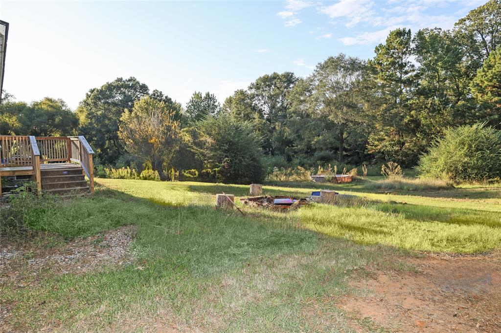 214 Destiny Lane Keatchie, LA 71046 - Photo 39 of 40 a view of a swimming pool with a yard