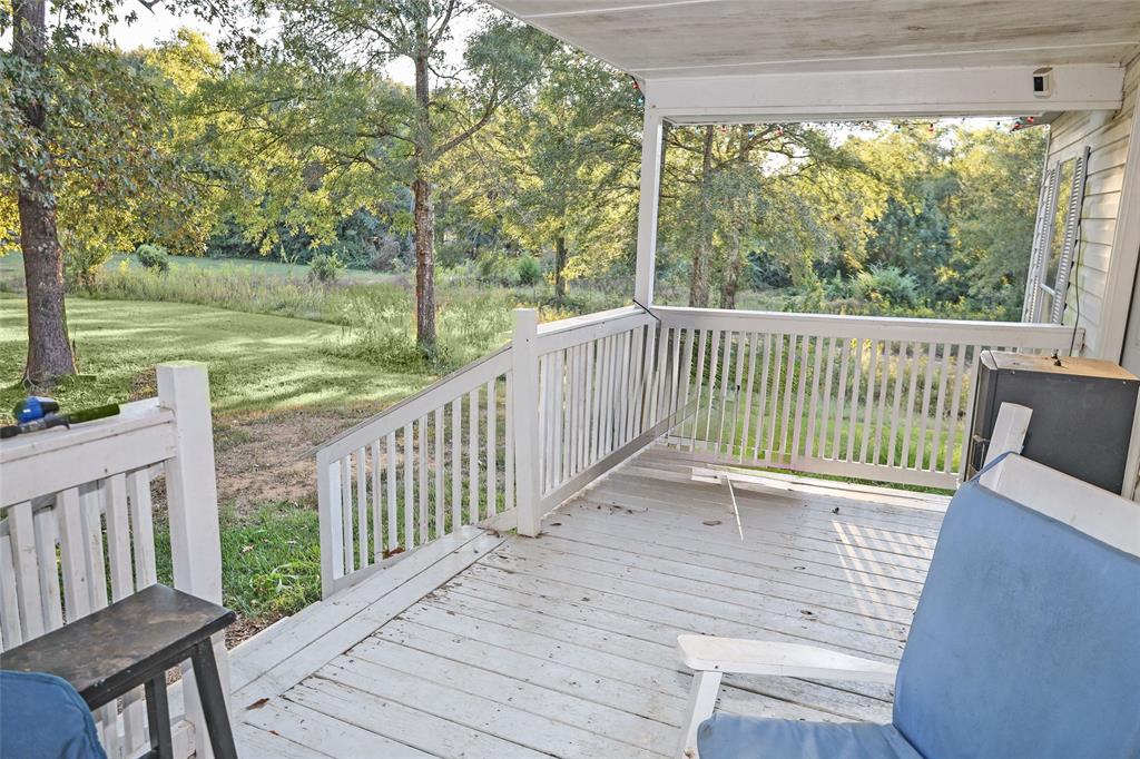 214 Destiny Lane Keatchie, LA 71046 - Photo 5 of 40 a view of a two chairs with a deck